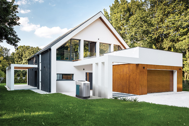 Modern single-family house on a forest plot with a heat pump in the front garden